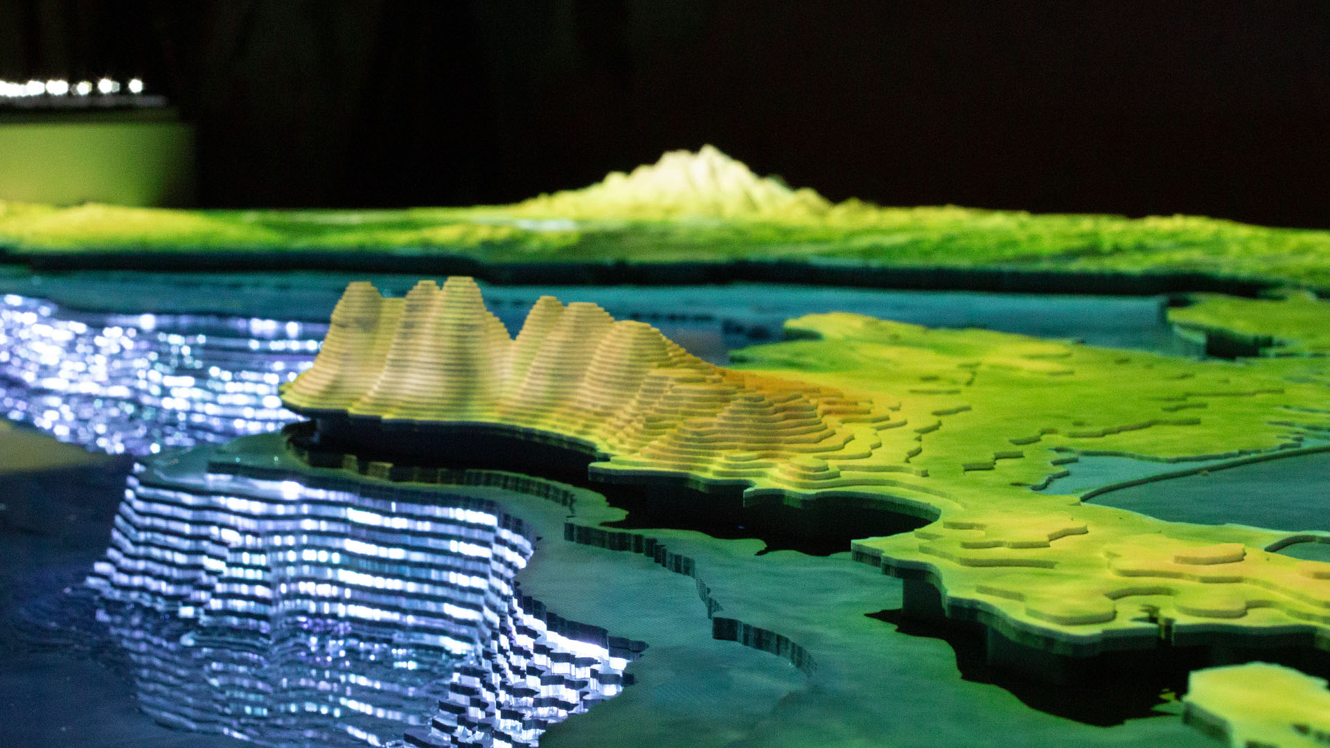 Turkstream presentation hall — landscape model with teal projection mapping
